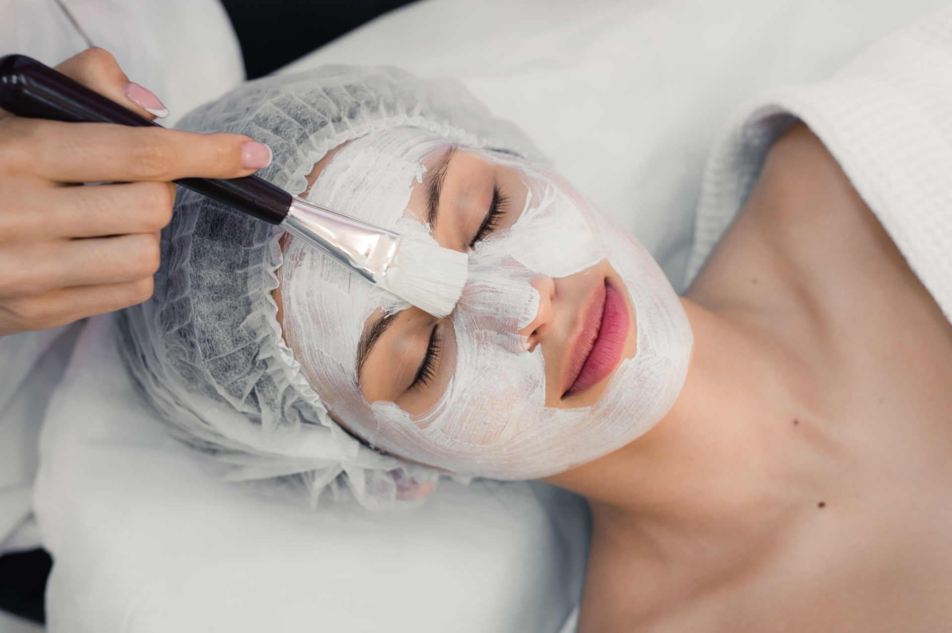 portrait-of-young-woman-while-facial-cosmetic-PGU9ZNZ.jpg
